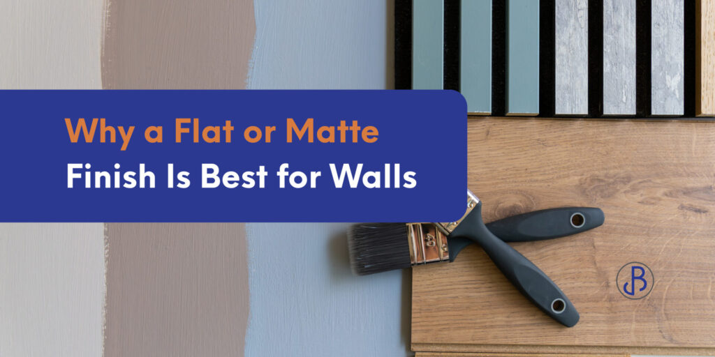 Paint samples in neutral tones beside a paintbrush on a wood surface, with the text ‘Why a Flat or Matte Finish Is Best for Walls’ displayed across the image.