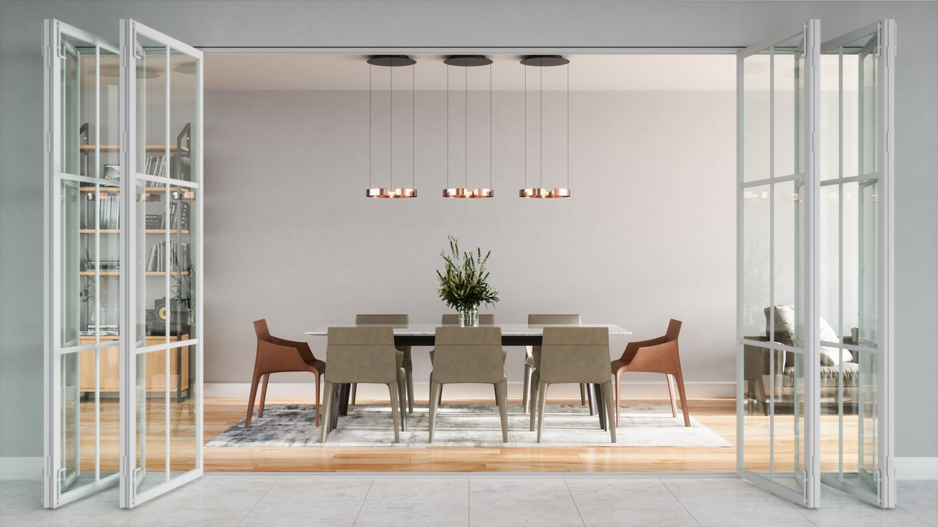Modern dining room with a large rectangular table, eight chairs, pendant lights above, a central plant arrangement, and glass doors opening to the space. - Jeff Bryant Painting