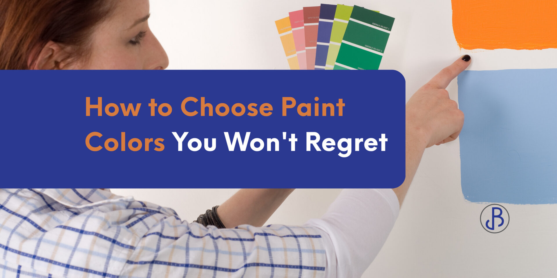 A person holding paint swatches and pointing at color samples on a wall, illustrating how to choose paint colors, with the text “How to Choose Paint Colors You Won’t Regret.”. - Jeff Bryant Painting